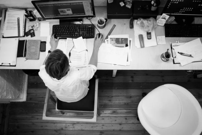 Canva - Black and Gray Photo of Person in Front of Computer Monitor (1)